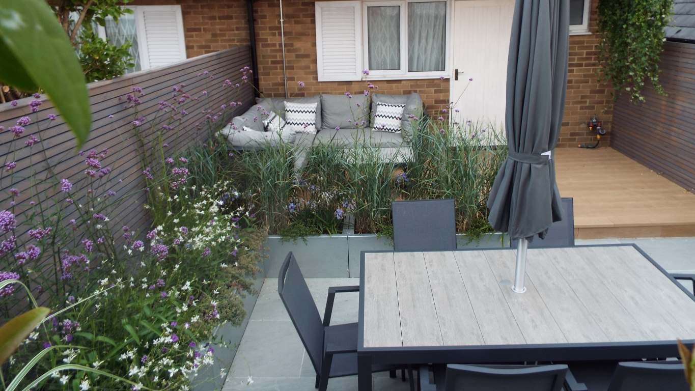 FuchsiaGreenltd_Garden_Design_Coastal_Garden_porcelainpaving_Grasses_Planting_outdoor_seating